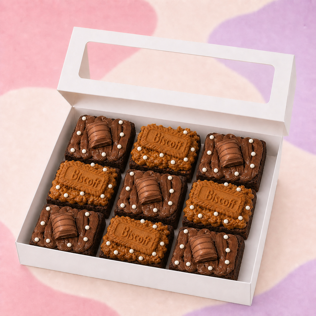 Open white box with nine BrowniBop Nutella and Cookie Butter brownies